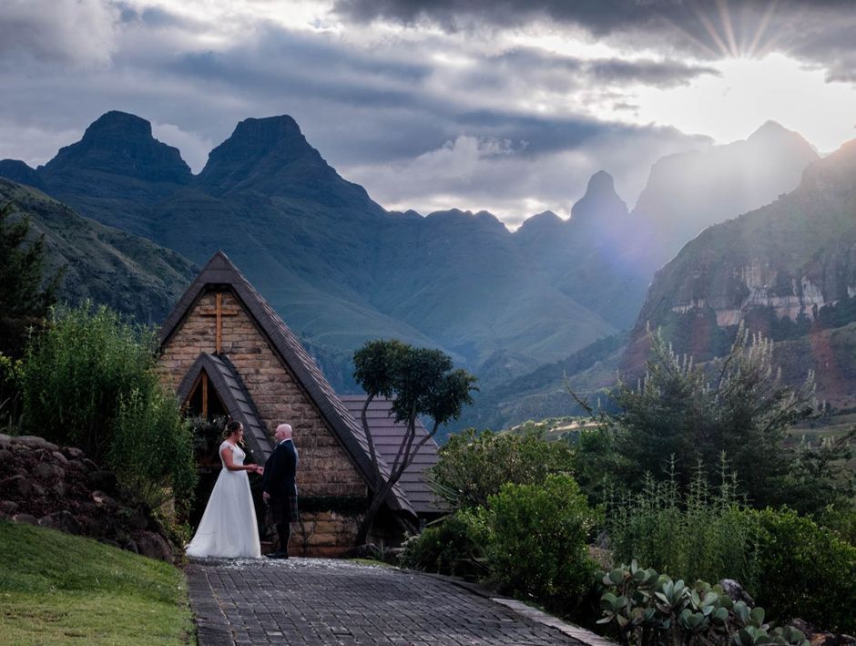 Bride and groom outside the Cathedral Peak Hotel chapel