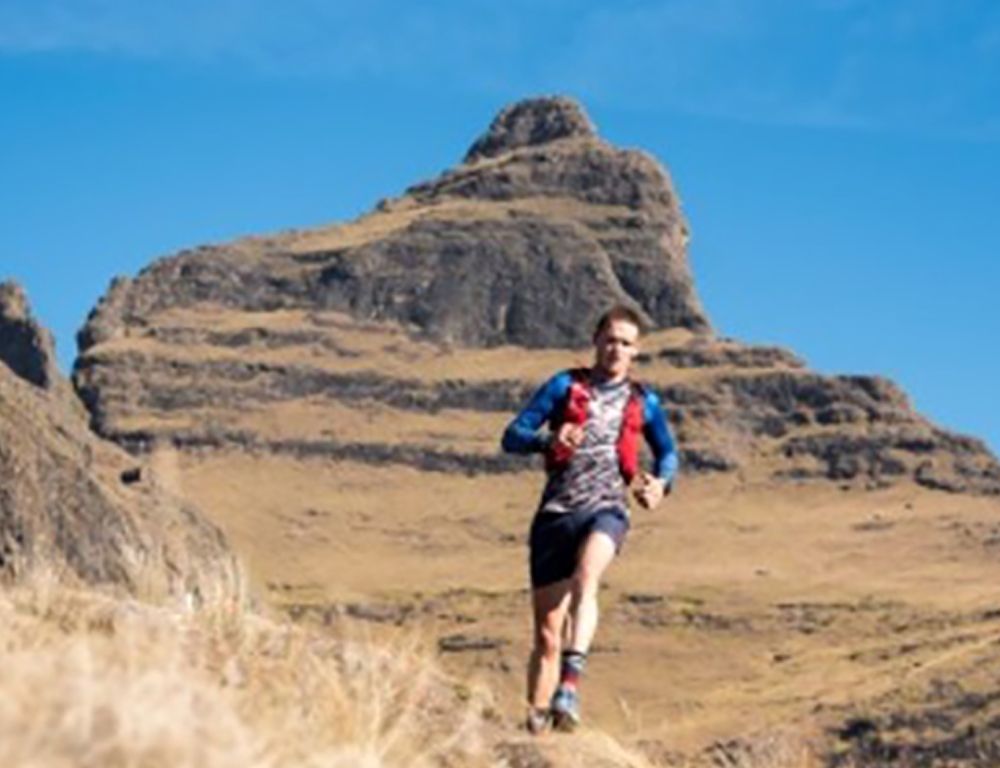 Man running on a trail